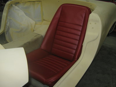 Red Seat in primered Elan.jpg and 